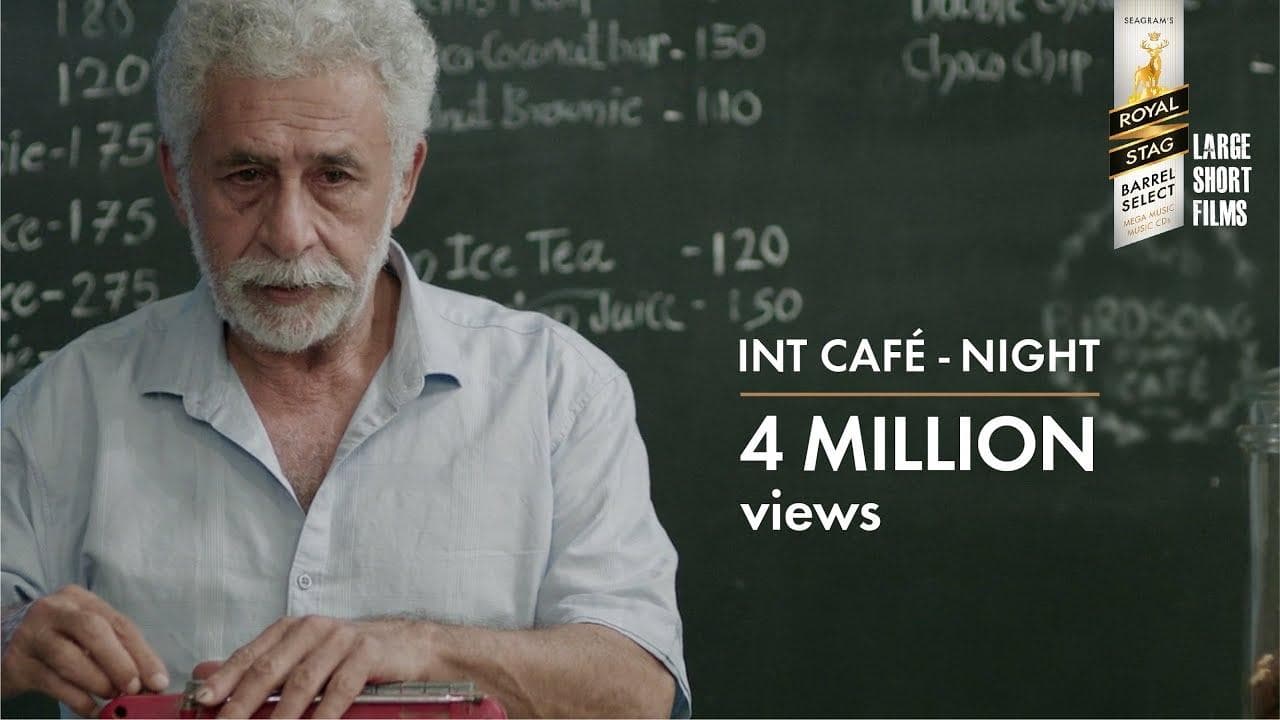 INT. CAFÉ – NIGHT backdrop