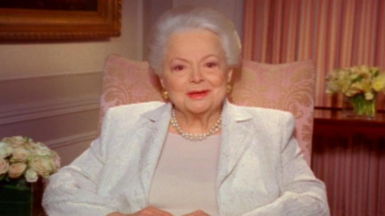 Melanie Remembers: Reflections by Olivia de Havilland backdrop